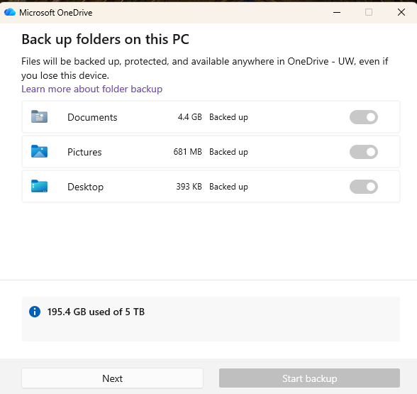 OneDrive "Back up folders on this PC" dialog showing Documents, Pictures, and Desktop folders already backed up